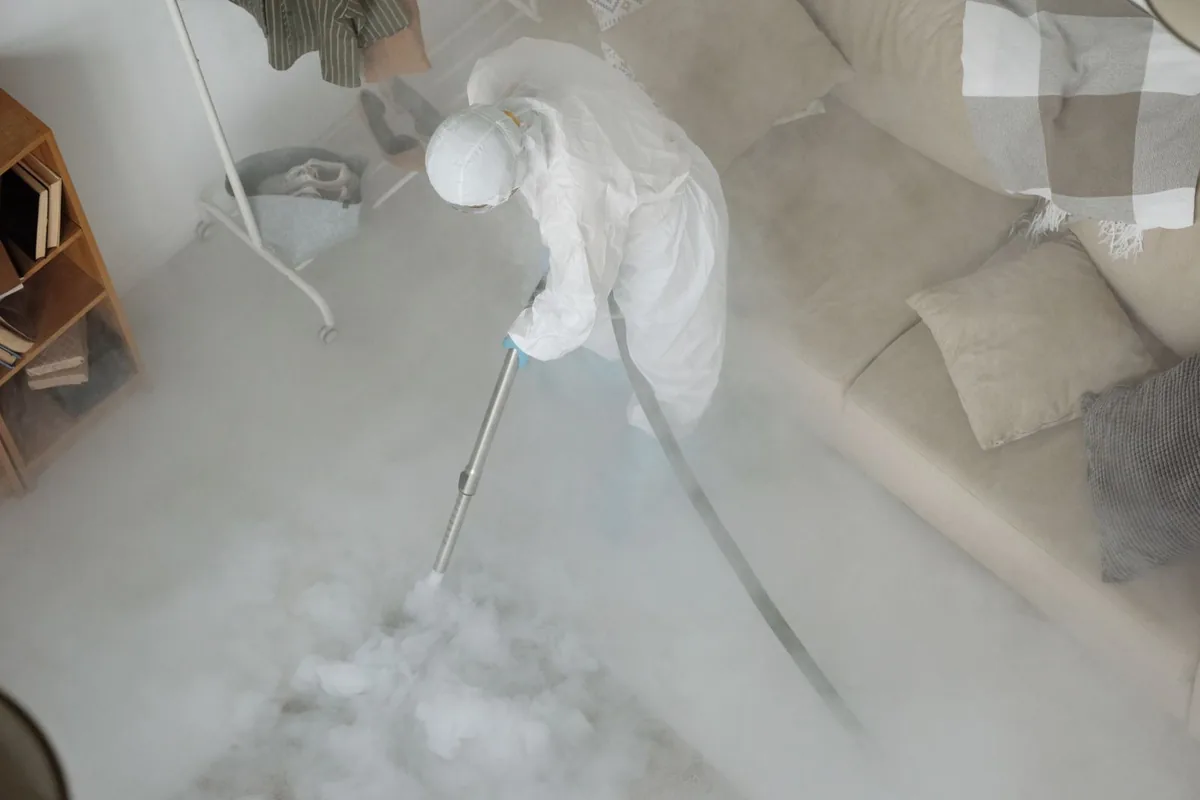 Biohazard cleanup technician in protective equipment, Mastic Beach, NY